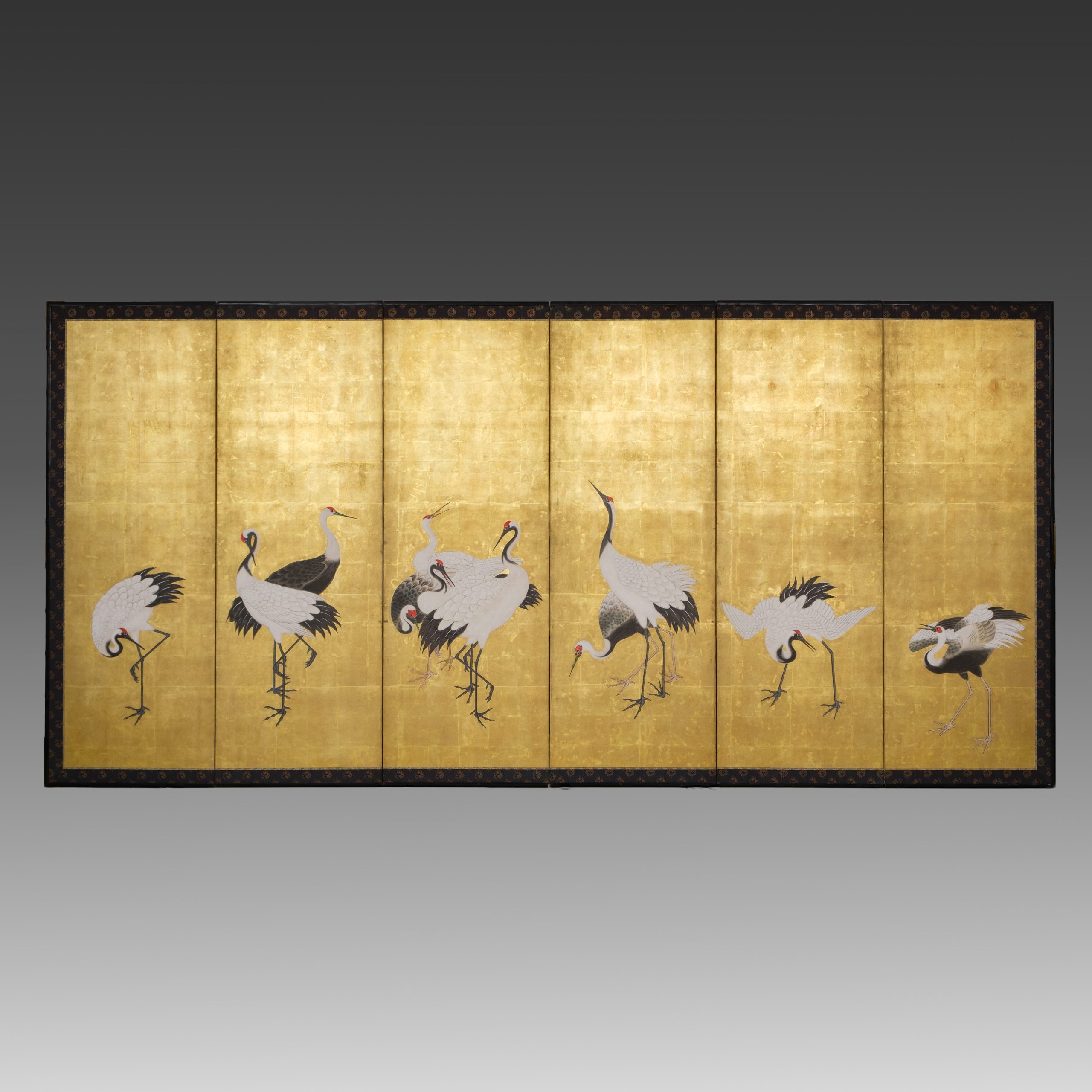 Tall screen cranes on gold leaf